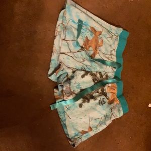 blue magellan shorts with leaves and branches